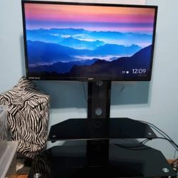 2 Flat Screen TV's with 1 Black Glass Tv Stand