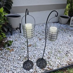 2  OUTDOOR METAL STANDS WITH GLASS CANDLE HOLDERS 