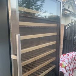  FREE.          188 Bottle Wine Cooler.  LIKE NEW.   NEEDS FREON 
