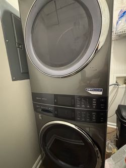 Grey Electrolux tower washer and dryer
