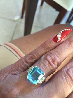 14k blue topaz ring with 6 diamonds