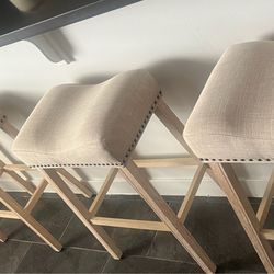 4 tan stools
