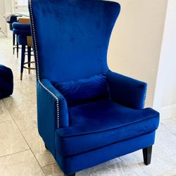 Elegant high-back chair upholstered in rich navy blue