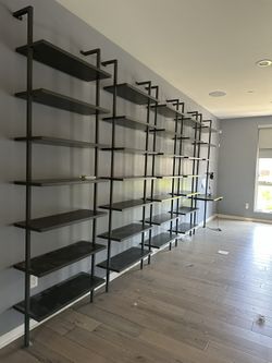 Gray CB2 96 inch metal wall mount bookshelf