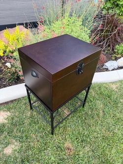 Wooden storage cabinet with metal stand