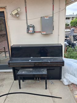 Black Upright Piano with Bench