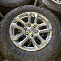 BRAND NEW CHEVY SILVERADO/ GMC SIERRA WHEELS WITH NEW GOODYEAR WRANGLER AT TIRES 265/65R18
