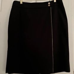 Calvin Klein  black pencil skirt size 12.  64 % polyester, 31% rayon, 5% spandex. Gold color zipper from top to bottom accent on the front. 23.5” from