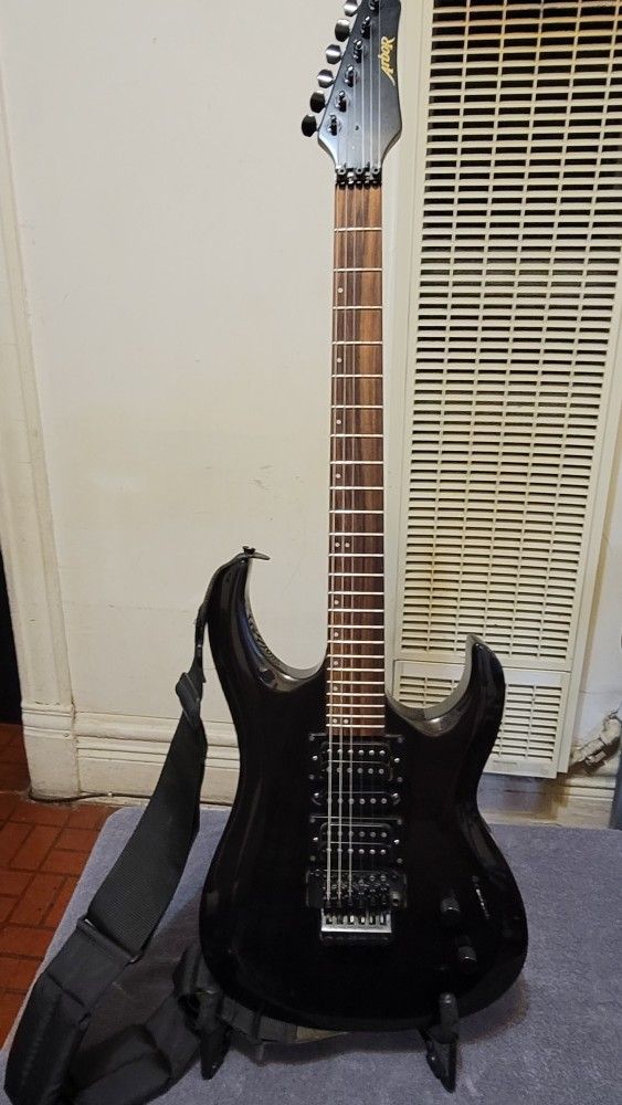 ARBOR ELECTRIC GUITAR MADE IN KOREA IN BLACK COLOR WITH FLOYD ROSE TREMOLO.