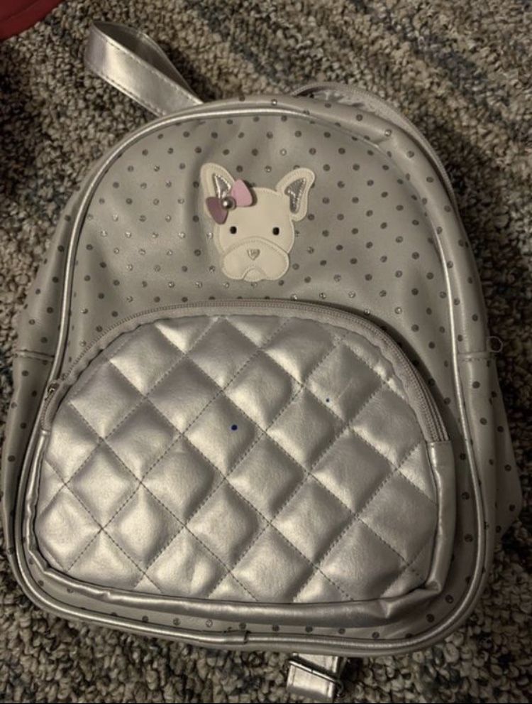 Small Backpack with dog head on it