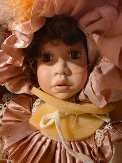 Porcelain Collector Doll in Pink Satin Dress