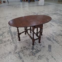 Antique drop leaf swing leg table