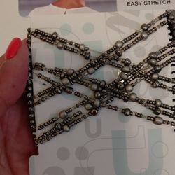 11 brand new hair accessories and one black pantyhose size M