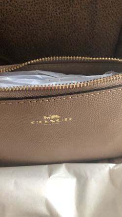 Brand new Coach wristlet, tan color