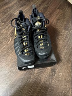 Black and gold Nike air foamposite