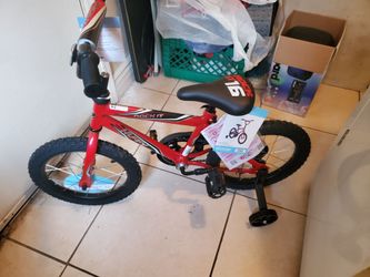 Brand new huffy kids bike with training wheels already assembled ready to ride