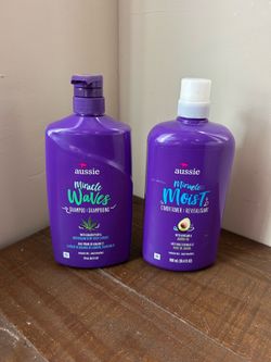 New, unopened large bottles of Aussie Miracle Waves shampoo & conditioner