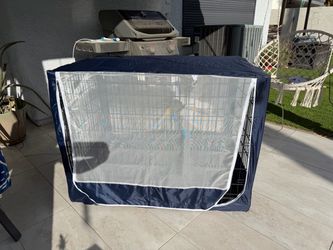 Dog’s metal cage with cover