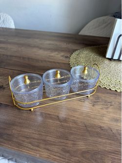 Small candy dishes, plastic with metal tray. Selling for $5