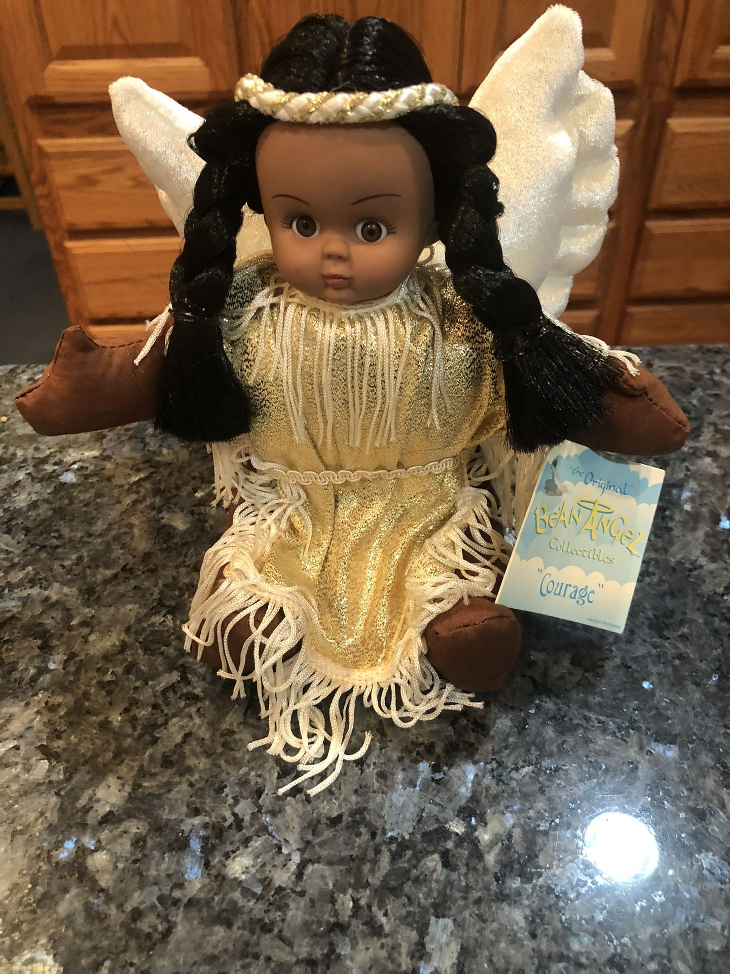 DollThe Original Bean Angel Collectibles Native American Stuffed Doll “Courage”.  With gold fringe dress.  Size 9 inches tall.  Brand New With Tags.  