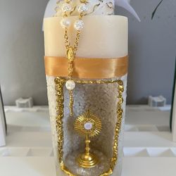 Decorative candle with rosary