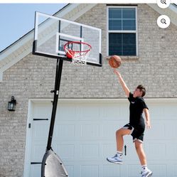 Spalding 54-Inch Portable Basketball Hoop with Shatter-Proof Polycarbonate Backboard, Adjustable ExactaHeight System & Pro Slam Rim-Outdoor Play