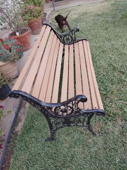 IRON BENCH  WOOD AND METAL.