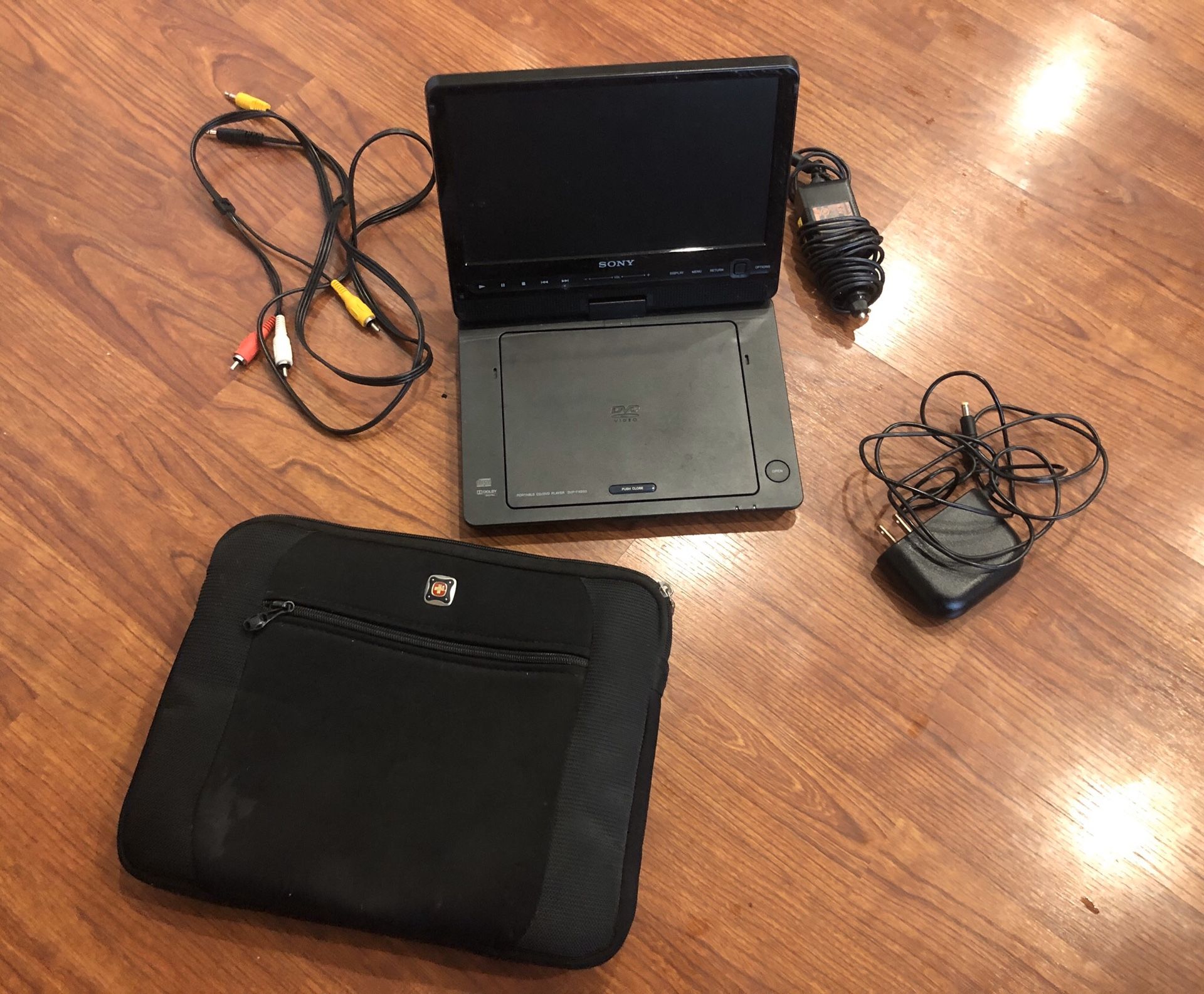 Travel DVD player. Great for kids - includes Swiss Gear case, car charger, wall charger, remote, and connection cables to use with TV