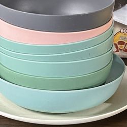Eight plastic bowls plate