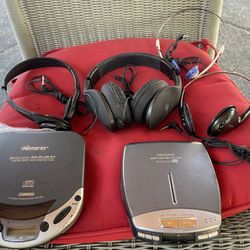 2 Portable Cd Players With 4 Pairs Of Headphones