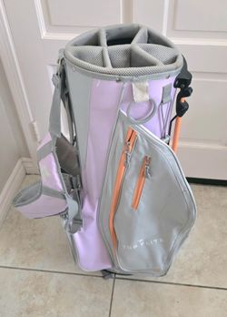 Top Flite Ladies Golf Stand Bag with 6 way top Women's lightweight multiple pockets pink gray in good pre-owned condition all zippers work a little di