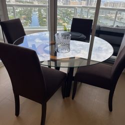Glass table was four chairs