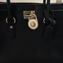 Michael Kors black Leather with gold trim shoulder bag