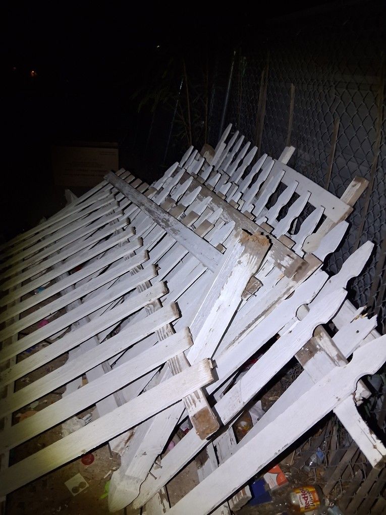 Eight sections of eight foot of six foot long white picket fencing wooden fencing four feet high