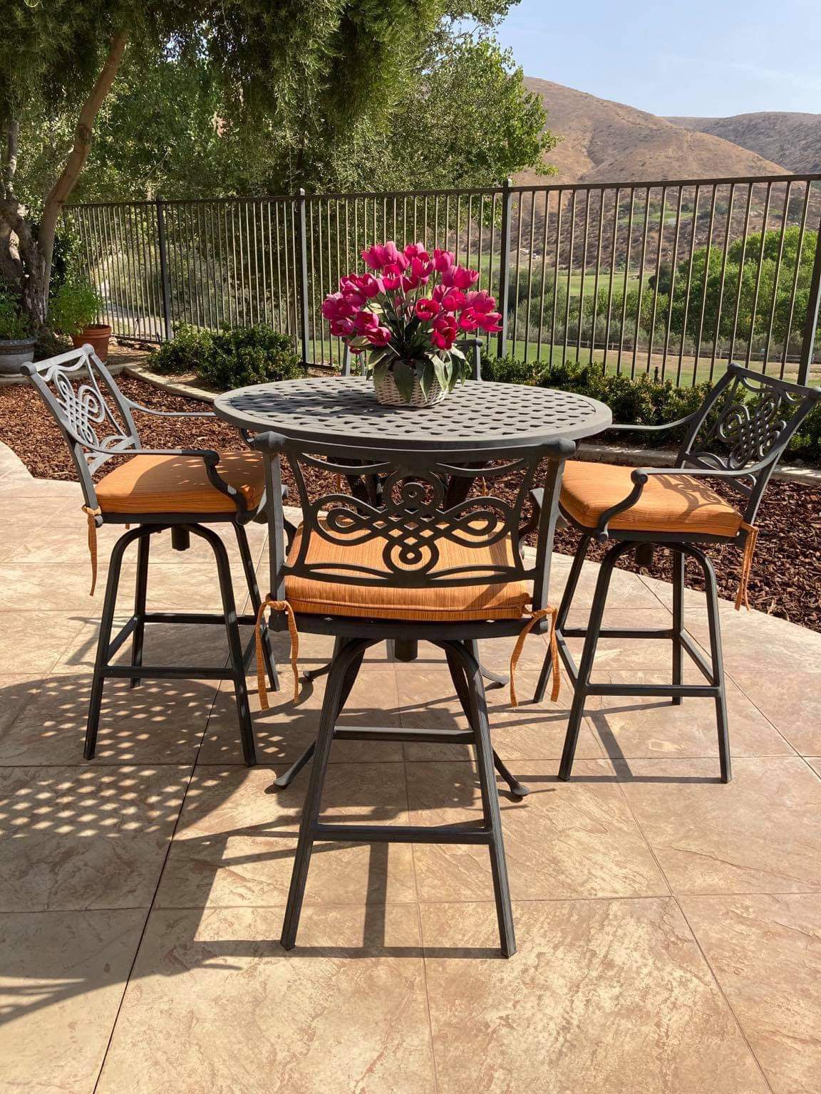 Wrought Iron Bar Height Table With 4 Swivel Chairs & 4 SunBrella Cushions.  PENDING SALE