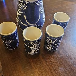 set of cups with jug