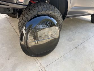 Defender spare tire cover