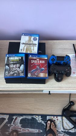 Sony PlayStation 4 PS4 Slim With 2 Controllers, Charging Dock, And 6 Games!