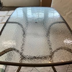 Glass patio table and 6 chairs with Cushions