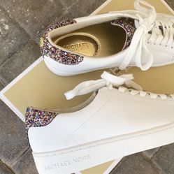 Michael Kors leather fashion sneaker 7.5M  NEVER WORN!! Has original sticker on bottom of shoe