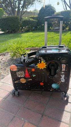 Kids sit and ride along suitcase