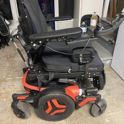 Orange Permobil Wheelchair 