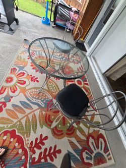Wrought iron table with 2 chairs