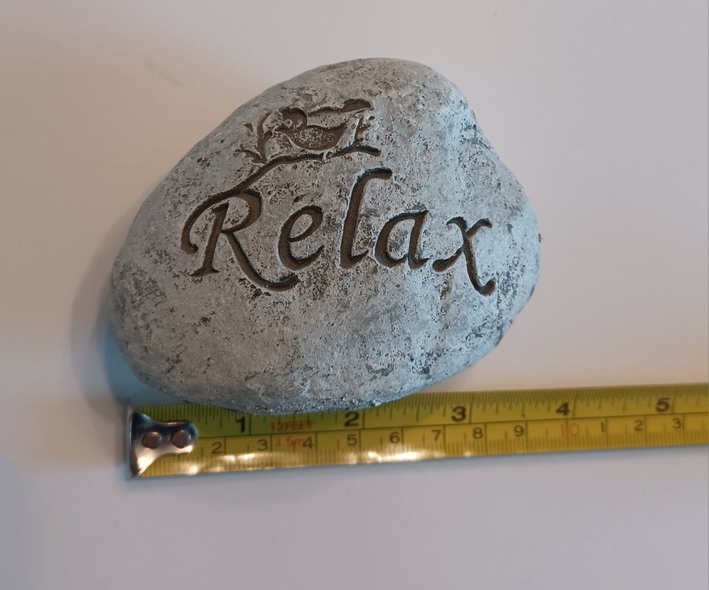 Faux Rock With Engraved Word "Relax"