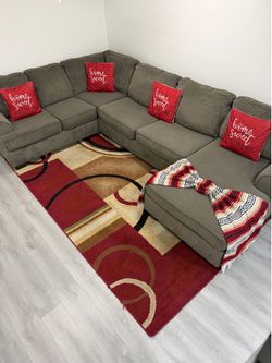 Beautiful 3-Piece Gray Sectional Sofa with chaise. Ashley Furniture. Delivery available for an additional cost.