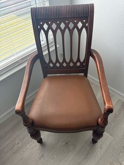 Antique Woden chair leather seat.