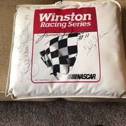 Winston Vinyl seat cusion autographed by Richard Petty, Junior Johnson and Bobby Allison.