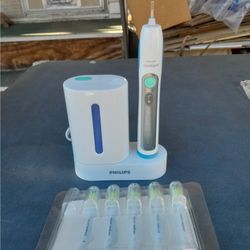 Phillips Sonicare UV Sanitizer Charger w/ Sonicare Toothbrush & (5) New Heads.