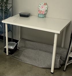 White dining table, seats 4. Minor scratches but overall in good condition.