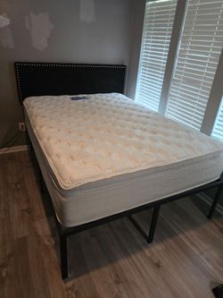 Queen bed with tall frame and backboard
